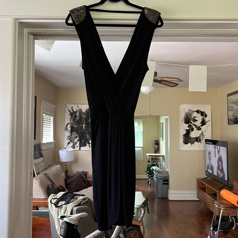 Black cocktail dress with silver accents by Akiko